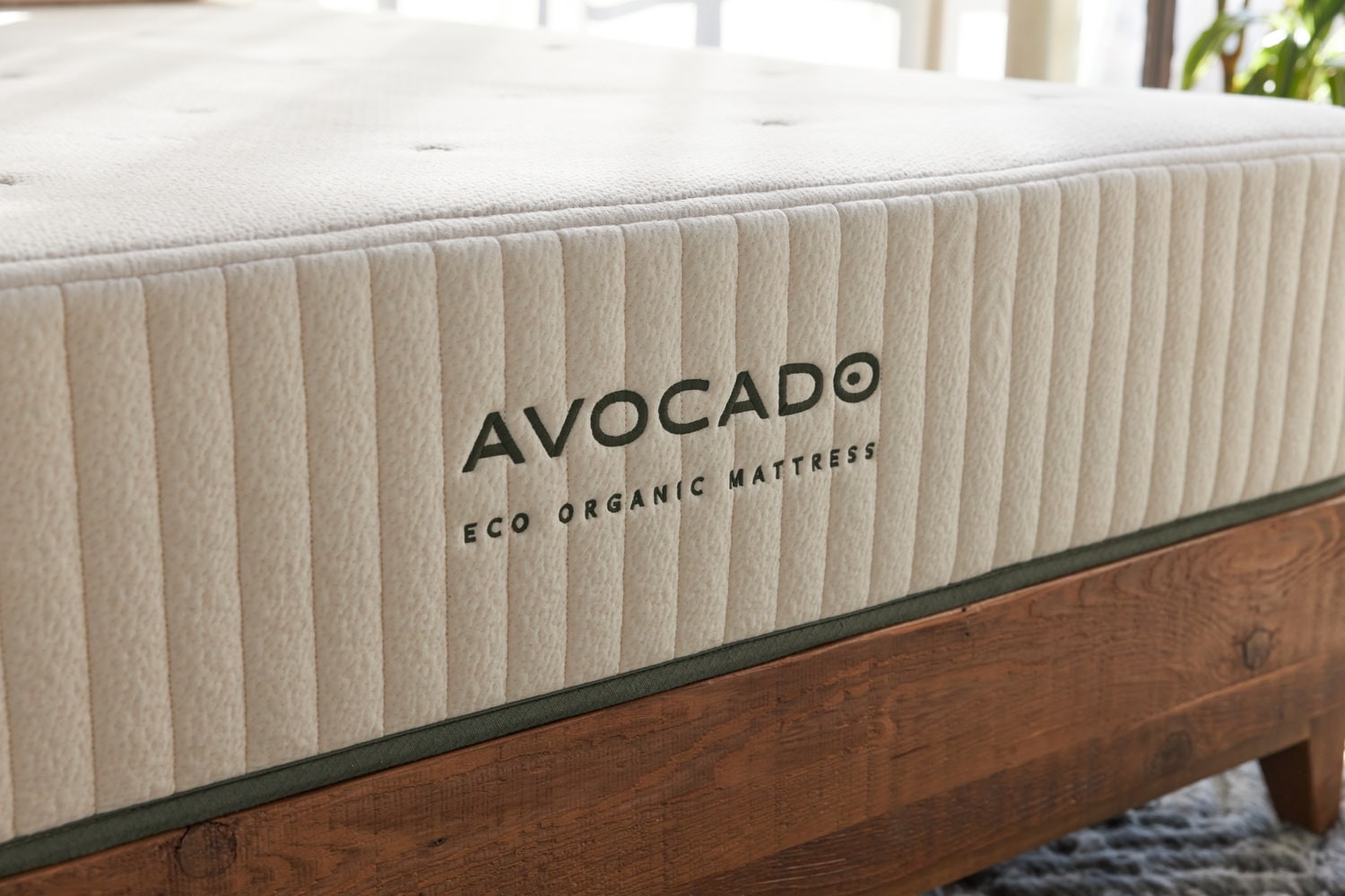 Avocado brand eco organic mattress on a wooden bed frame