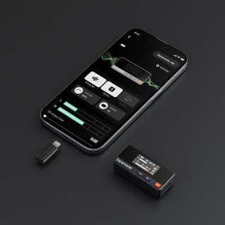 Smartphone displaying battery health app with external battery and connector on a dark surface