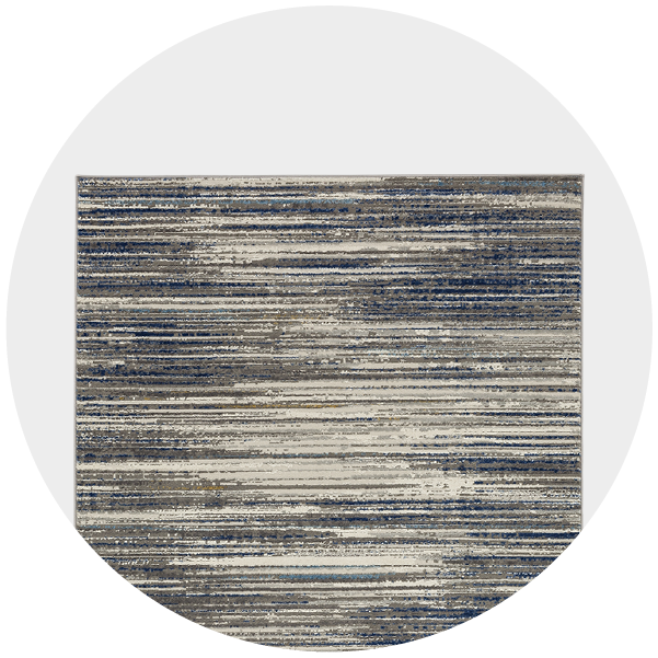 A circular cropped image of a textured rug with horizontal grey and cream stripes