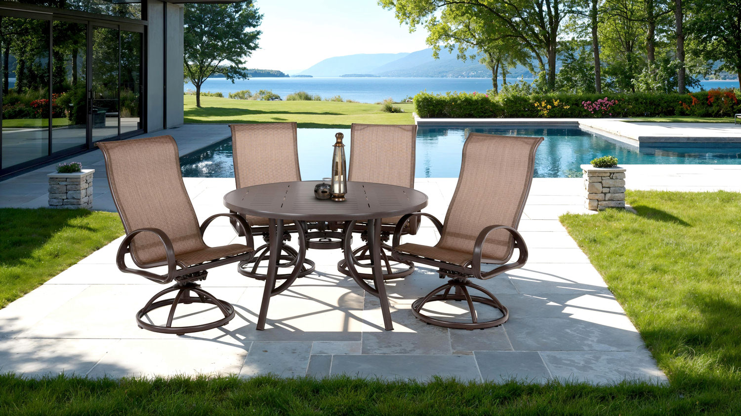 Outdoor patio with dining set overlooking a pool and lake