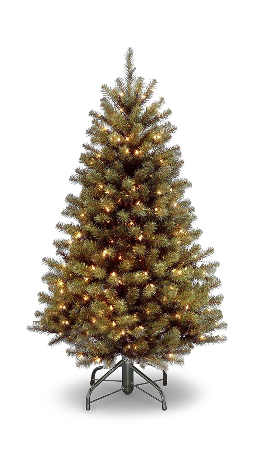 Pre-lit artificial Christmas tree on a metal stand, isolated on a white background