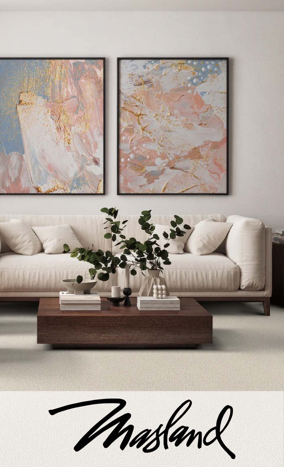 Elegant living room with a beige sofa, decorative paintings, and a coffee table with books and a plant