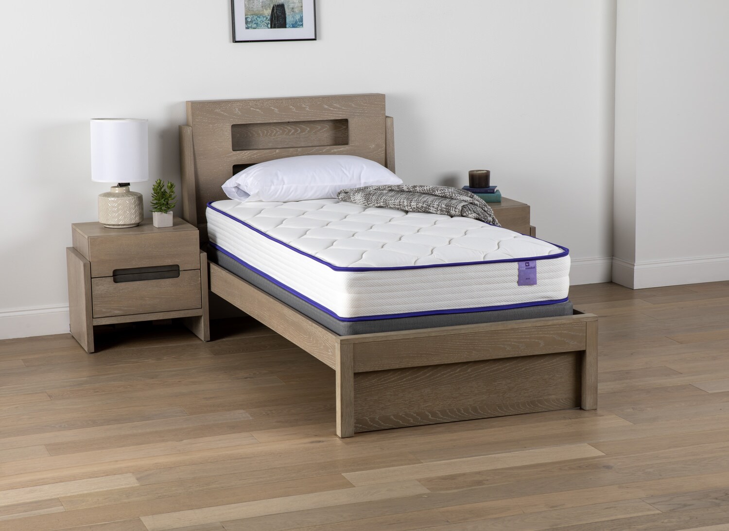 Modern bedroom with a single bed and matching wooden nightstand