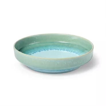 A light blue ceramic bowl, likely a kitchen or dining item, used for serving or preparing food