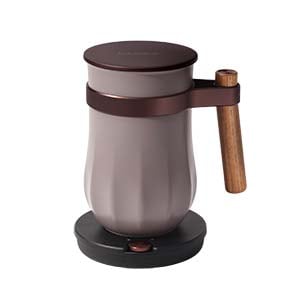 A gray and brown manual coffee grinder with a wooden handle