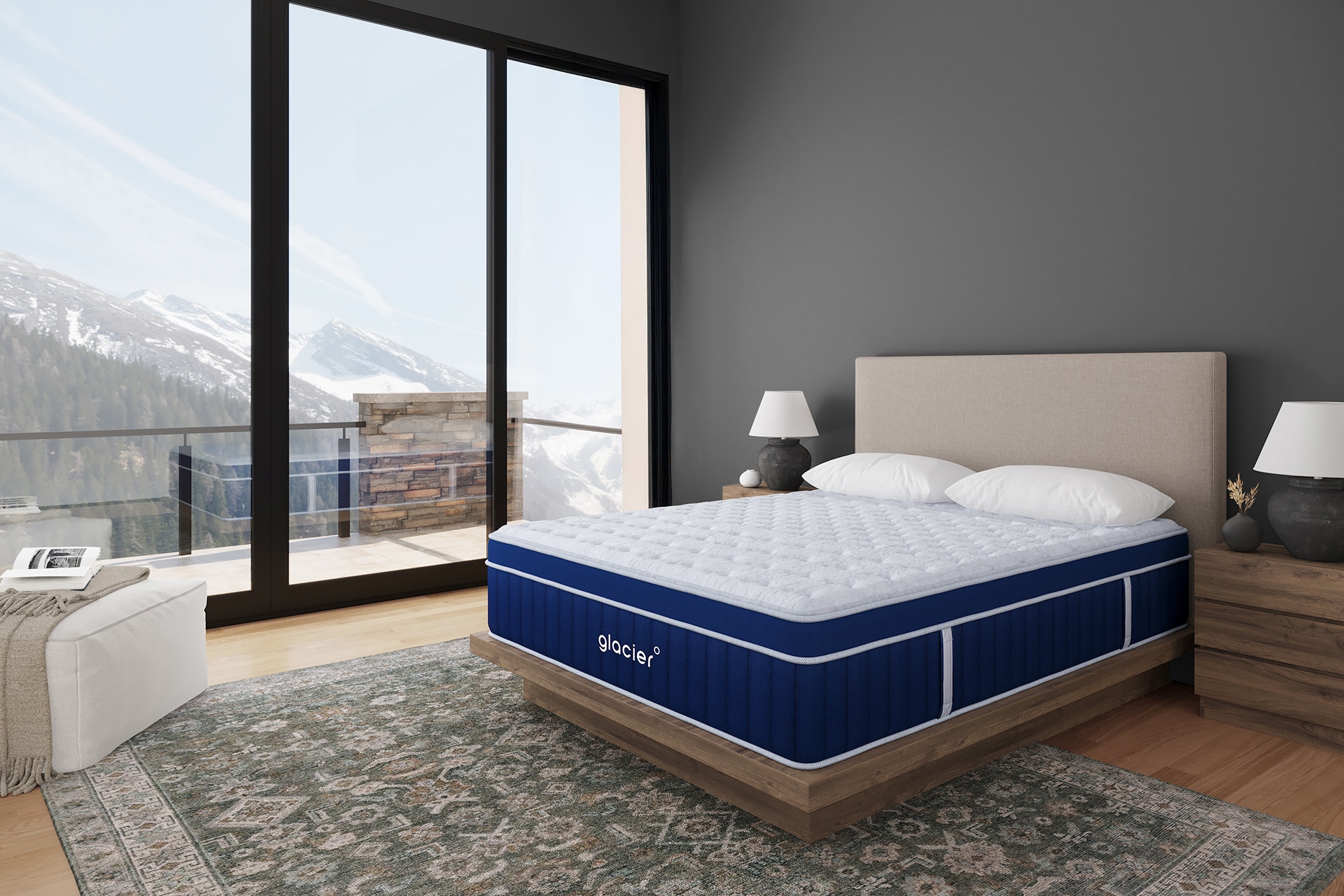 Modern bedroom with large bed, floor-to-ceiling windows showing snowy mountain view