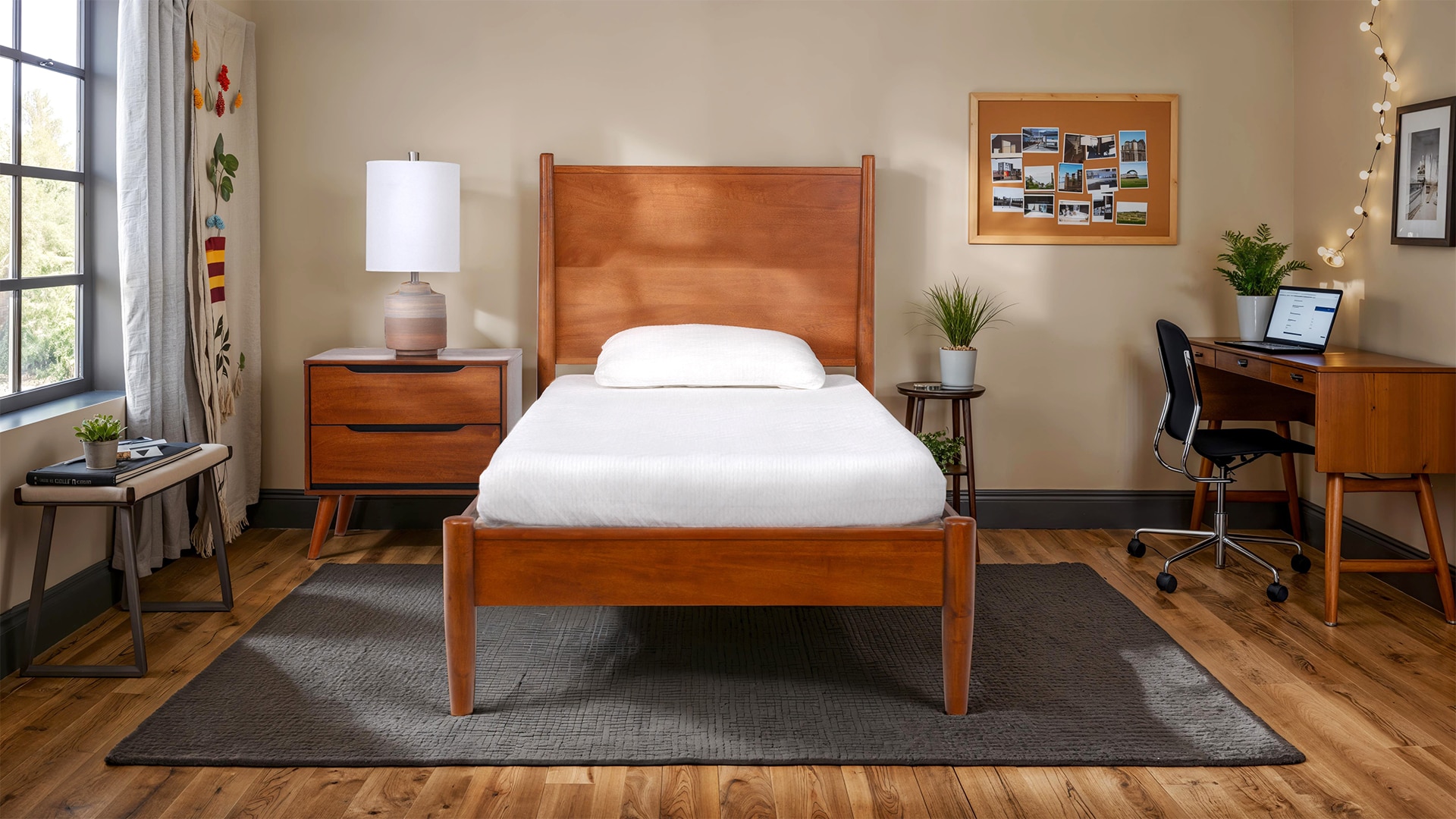 Modern bedroom with a wooden bed, matching nightstand and desk, area rug, and a window