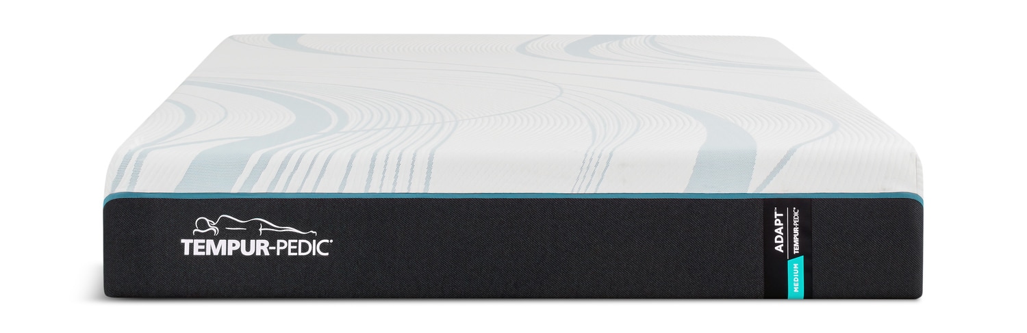 Side view of a Tempur-Pedic mattress topper on a white background