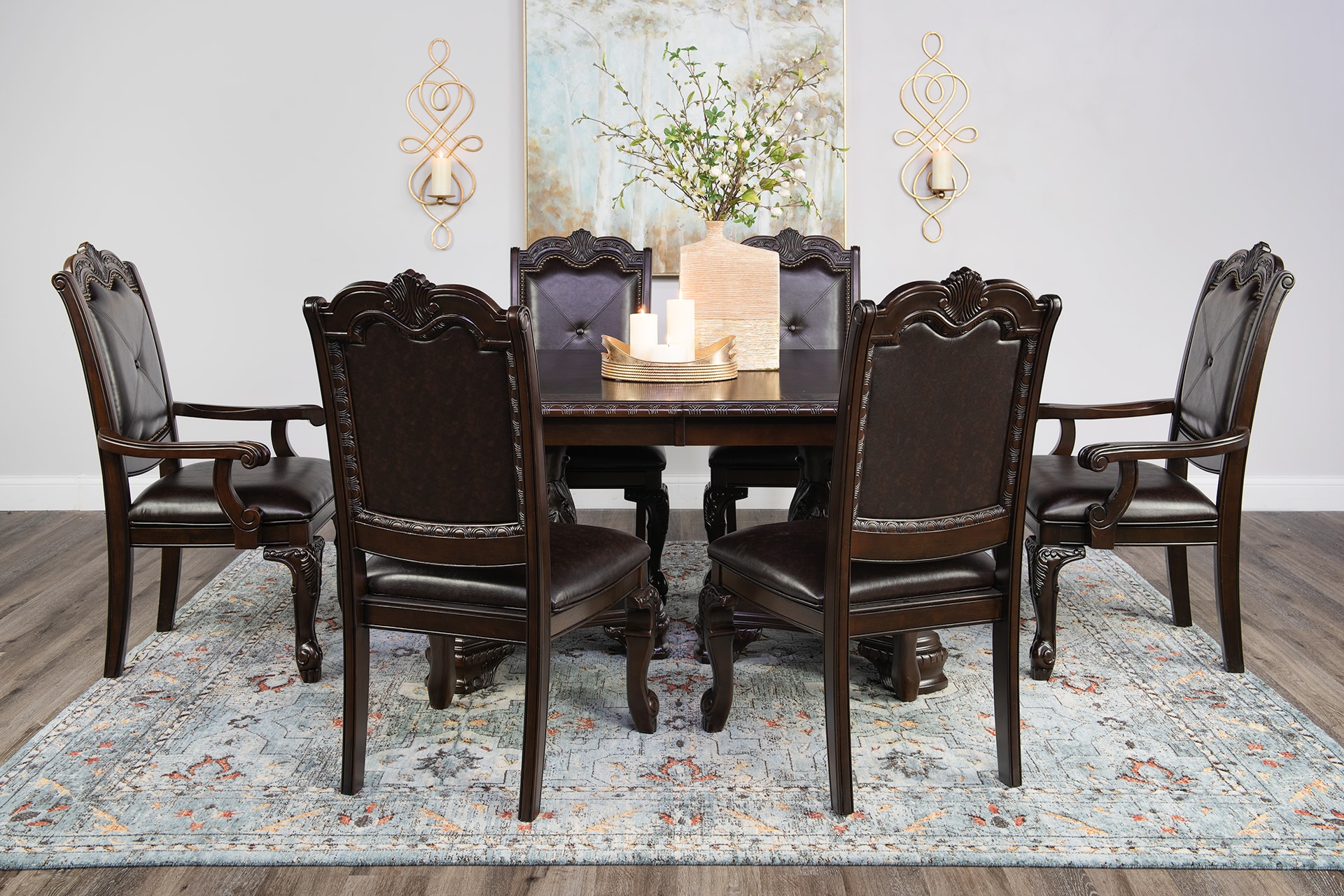 Elegant dining room setup with a dark wooden table, six ornate chairs, and decorative candles, under wall-mounted sconces