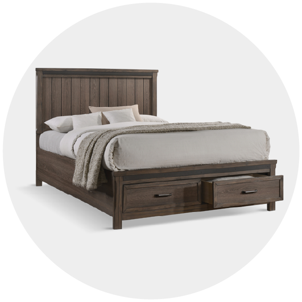 Wooden bed frame with two storage drawers and white bedding on a white background