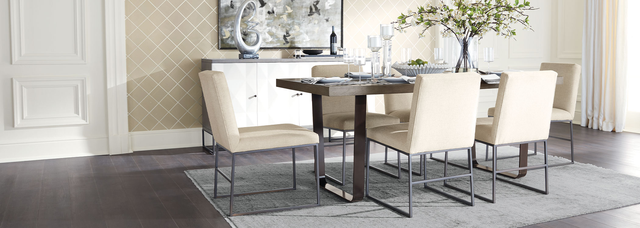 Modern dining room with a rectangular table, six chairs, and a sideboard