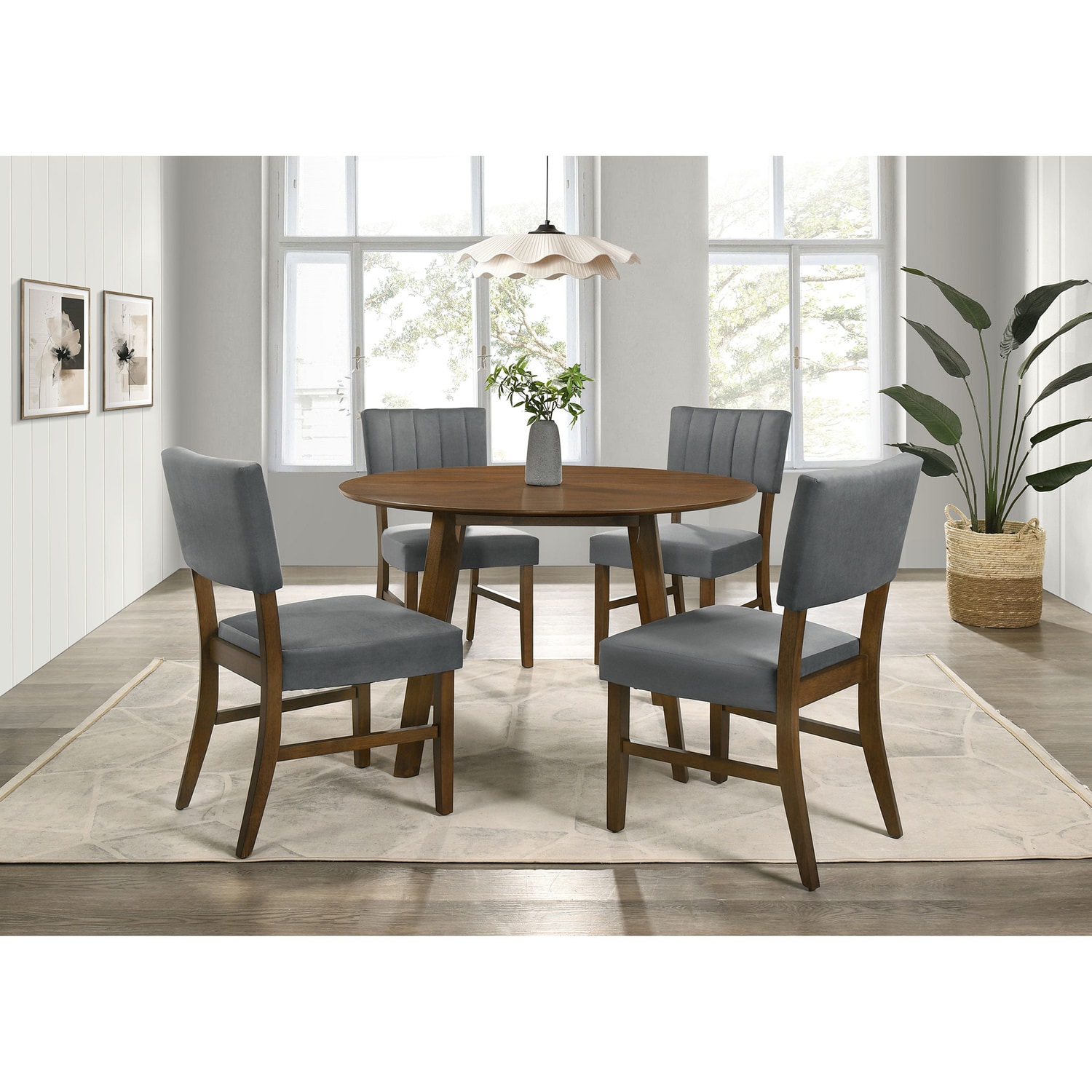 Modern dining room with a round wooden table, four blue chairs, large windows, and a potted plant