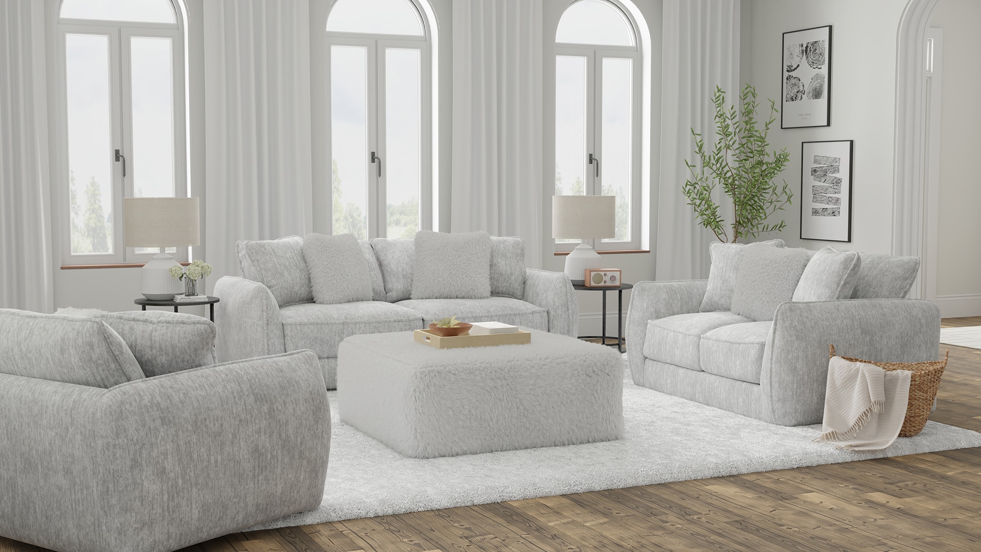 Modern living room with gray sofas, white rug, and large windows