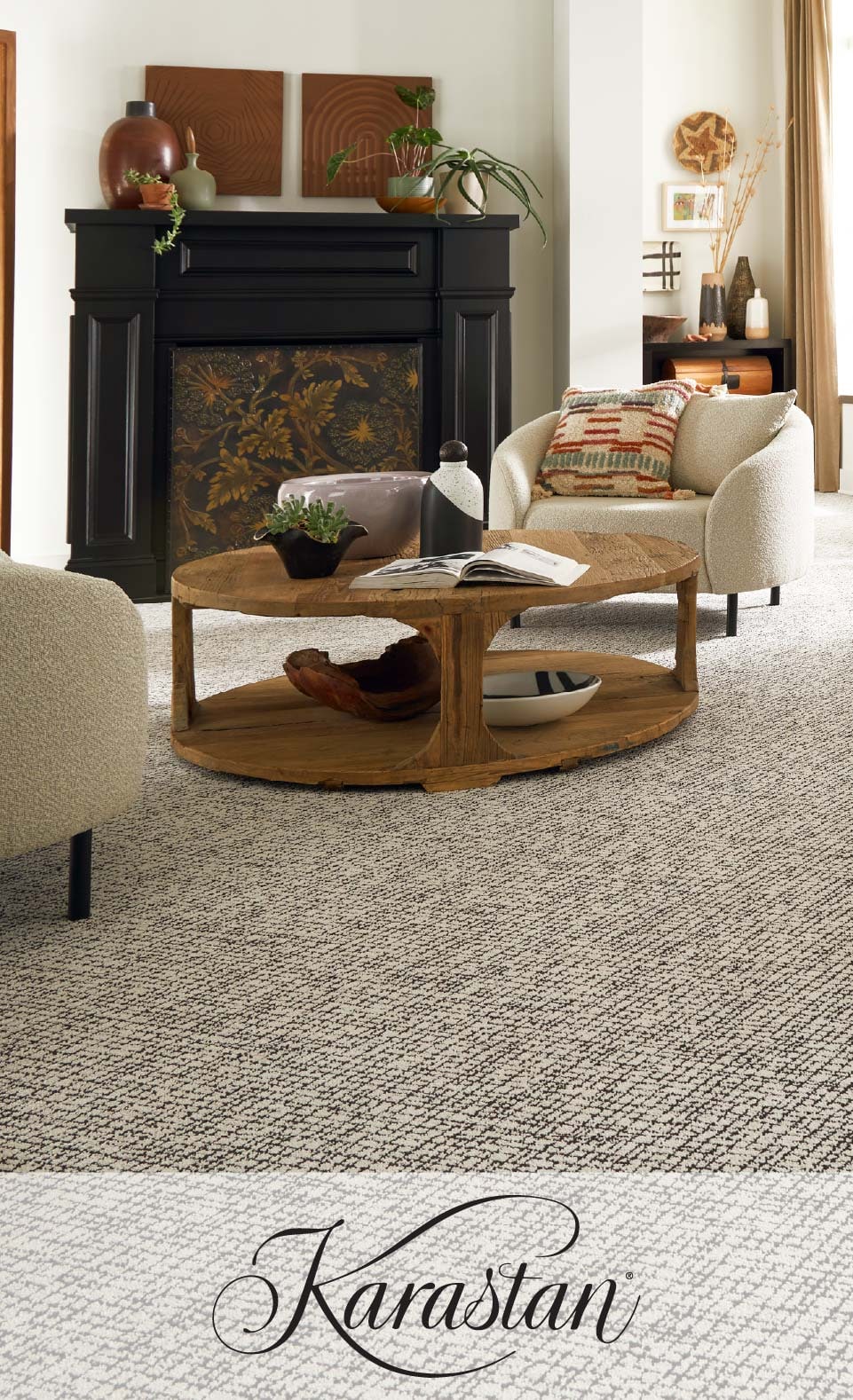 Elegant living room with a stylish round wooden coffee table, textured carpet, fireplace, and subtle decor