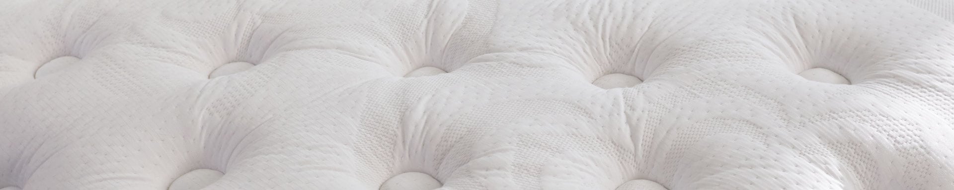 Close-up of a white tufted fabric texture