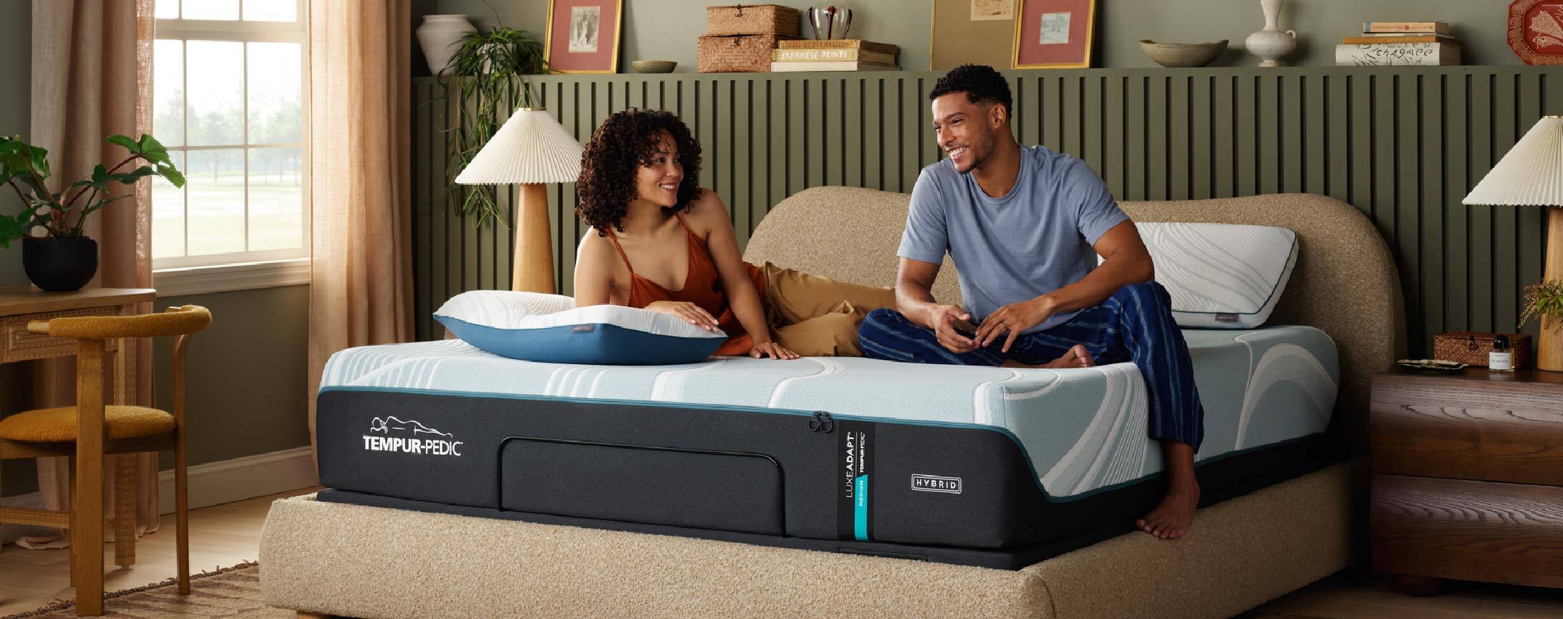 A couple relaxing on a high-tech mattress in a cozy bedroom setting