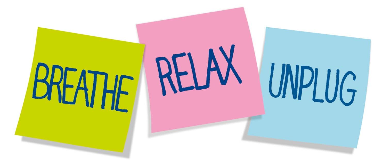 Three sticky notes with words "BREATHE," "RELAX," and "UNPLUG" in yellow, pink, and blue respectively