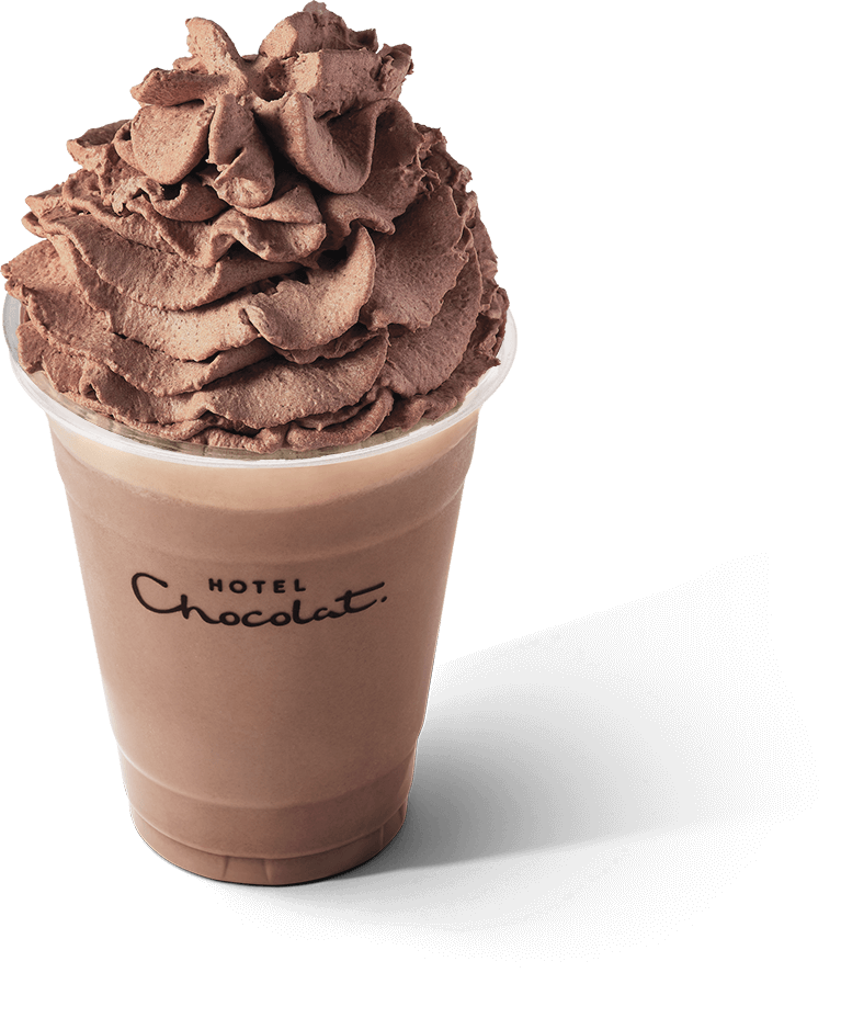 A cup of hot chocolate topped with whipped cream