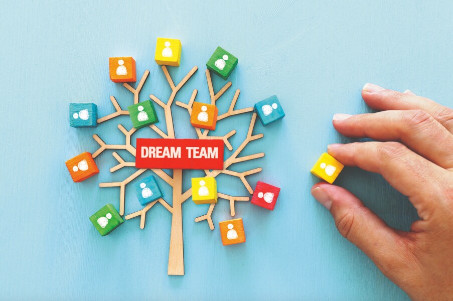 Colorful tree symbolizing teamwork with "Dream Team".