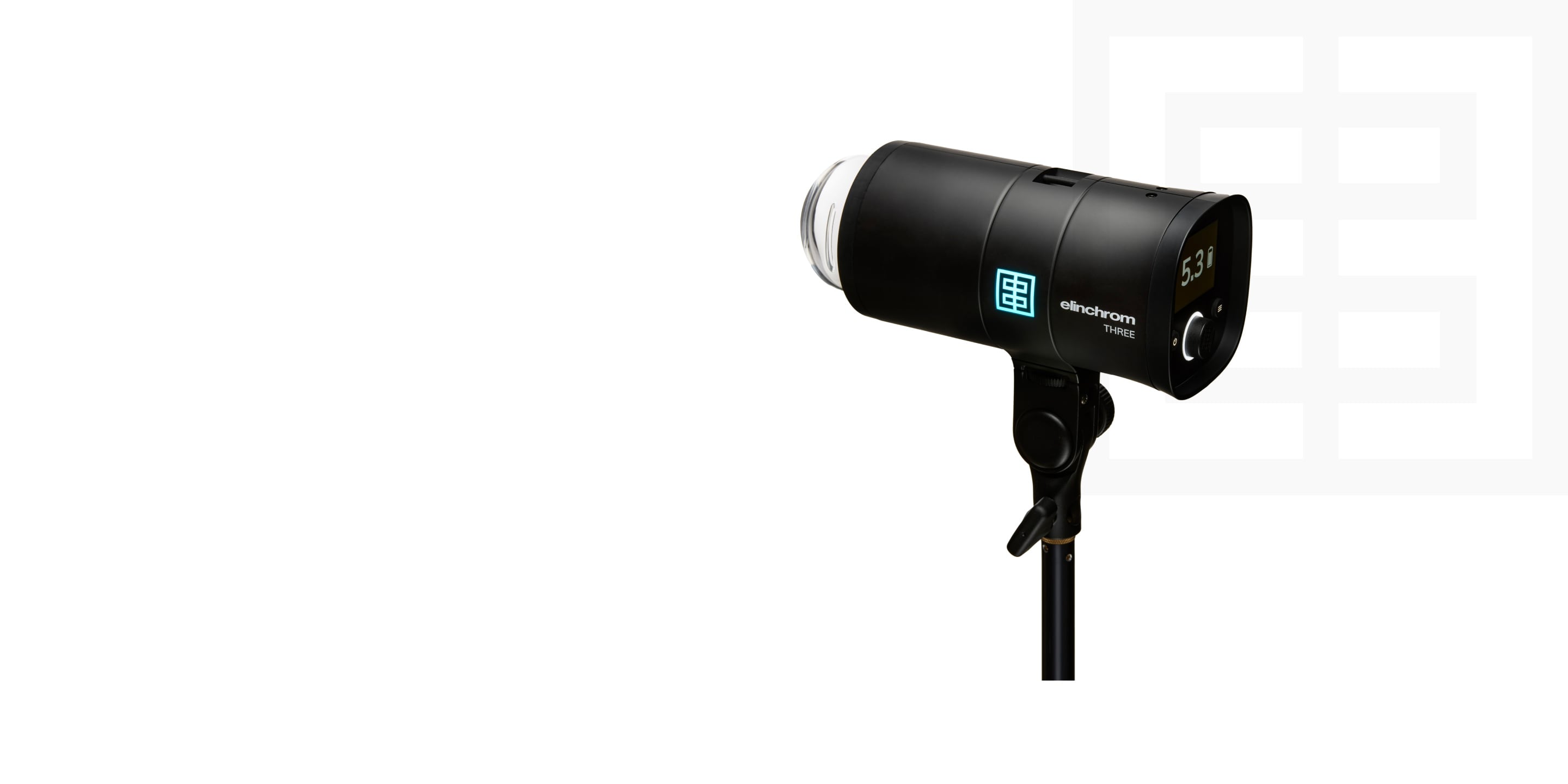 Black studio strobe light with blue logo on a light stand, isolated on a white background