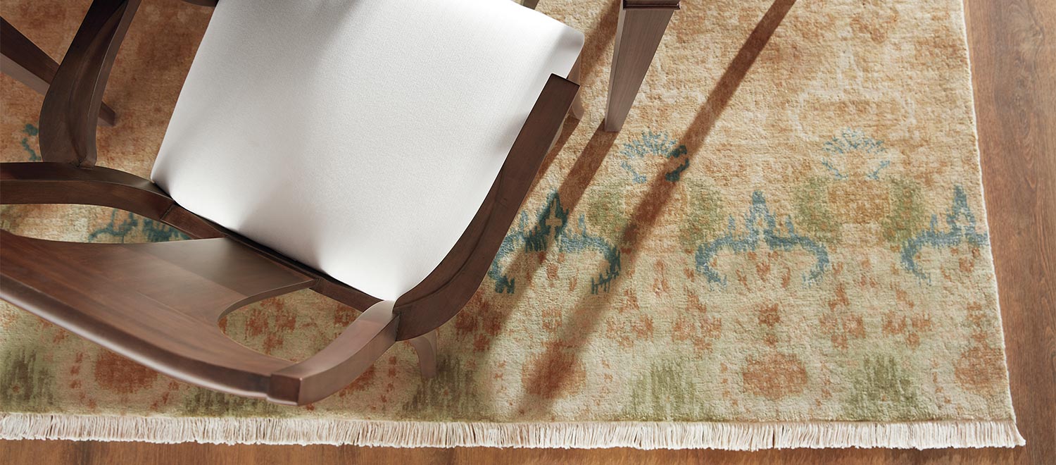 Wooden rocking chair on a patterned area rug