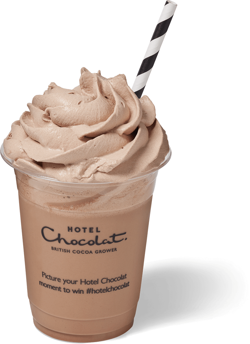 Iced chocolate drink with whipped topping and a striped straw in a branded clear cup