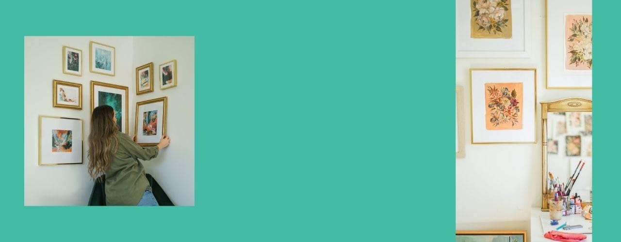 Woman adjusting framed art on wall in a room with pastel aesthetics and a teal background