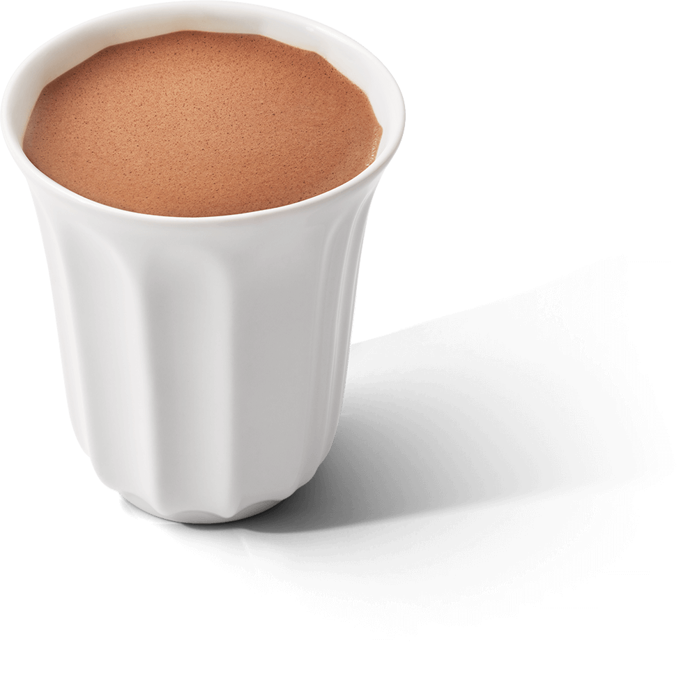 A white ceramic cup filled with hot chocolate, isolated on a white background