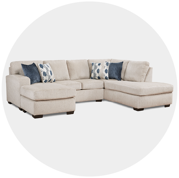 L-shaped beige sectional sofa with throw pillows on a white background
