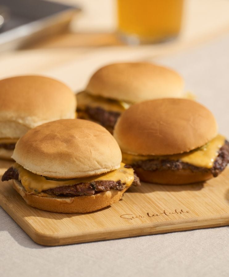 Sur La Table wooden cutting board with cheeseburgers