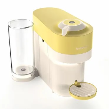 Yellow and white compact juicer with a glass and drip tray on white background