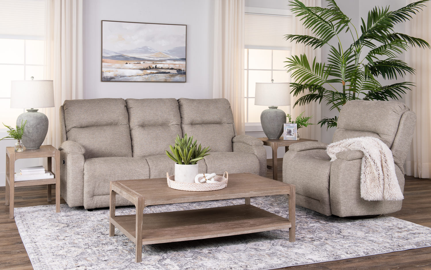 Modern living room with a beige sofa, wooden coffee table, and indoor plants