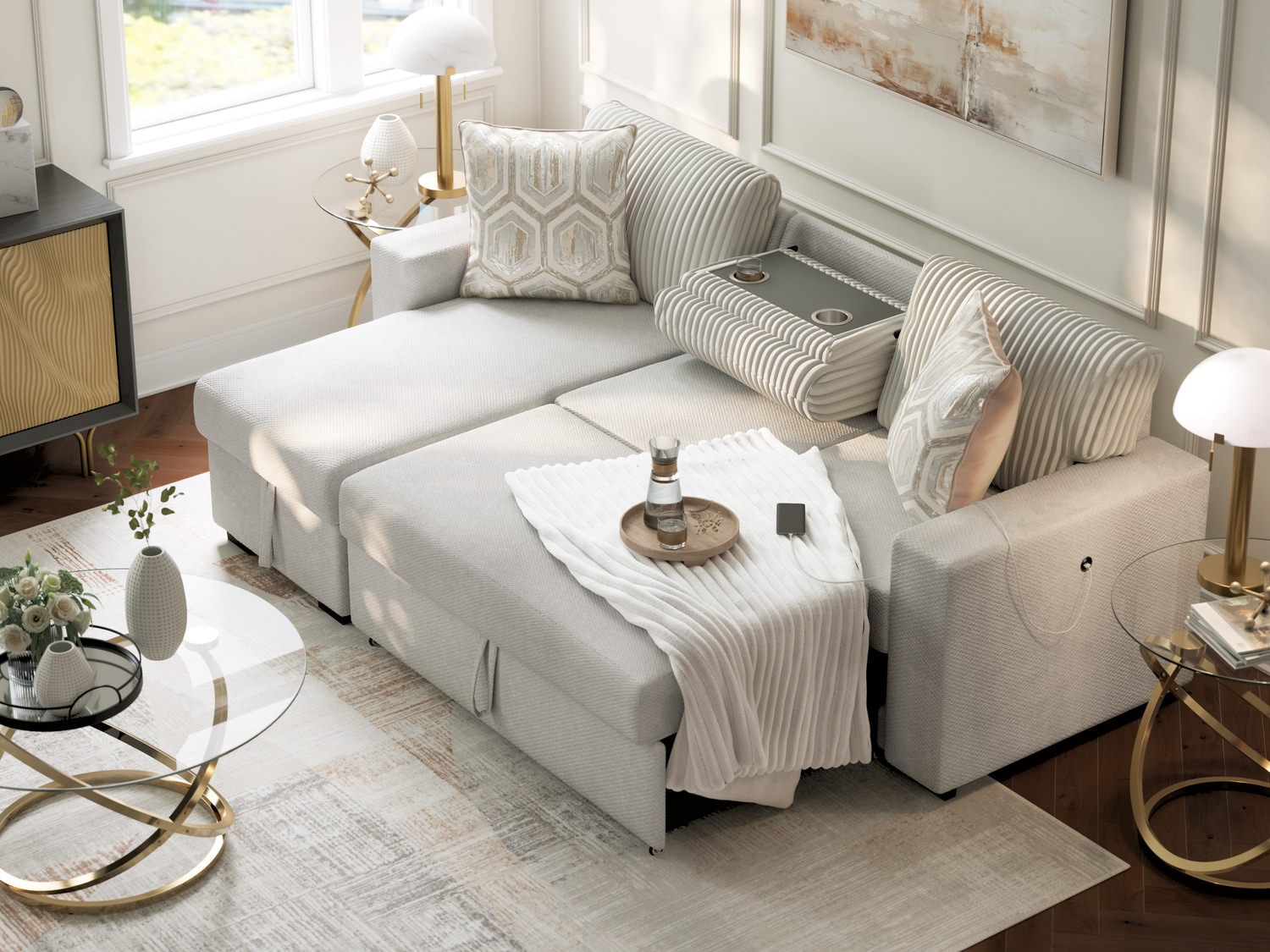 Cozy living room with a modern sofa bed, elegant decor, and natural light