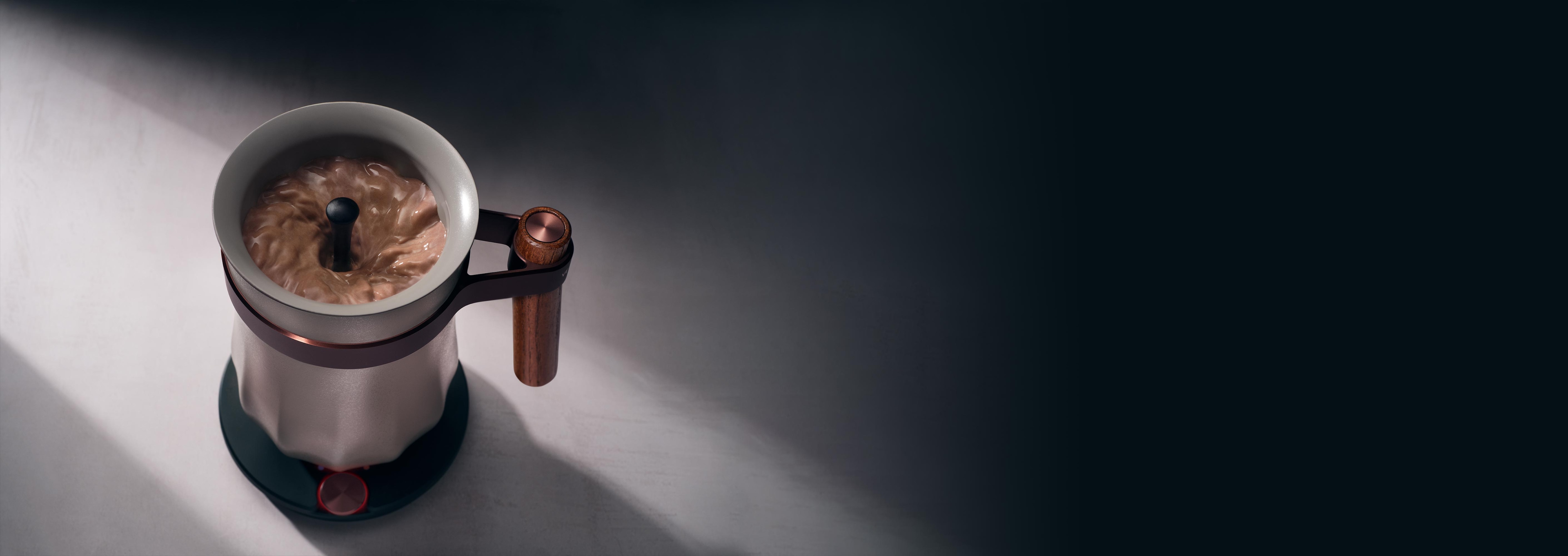 Vietnamese phin filter brewing coffee on a table, illuminated by natural light