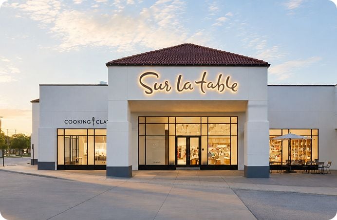 Sur La Table storefront at dusk