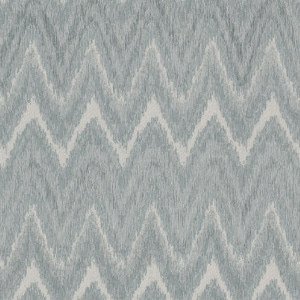 A textured fabric pattern featuring repeated gray and white zigzag lines