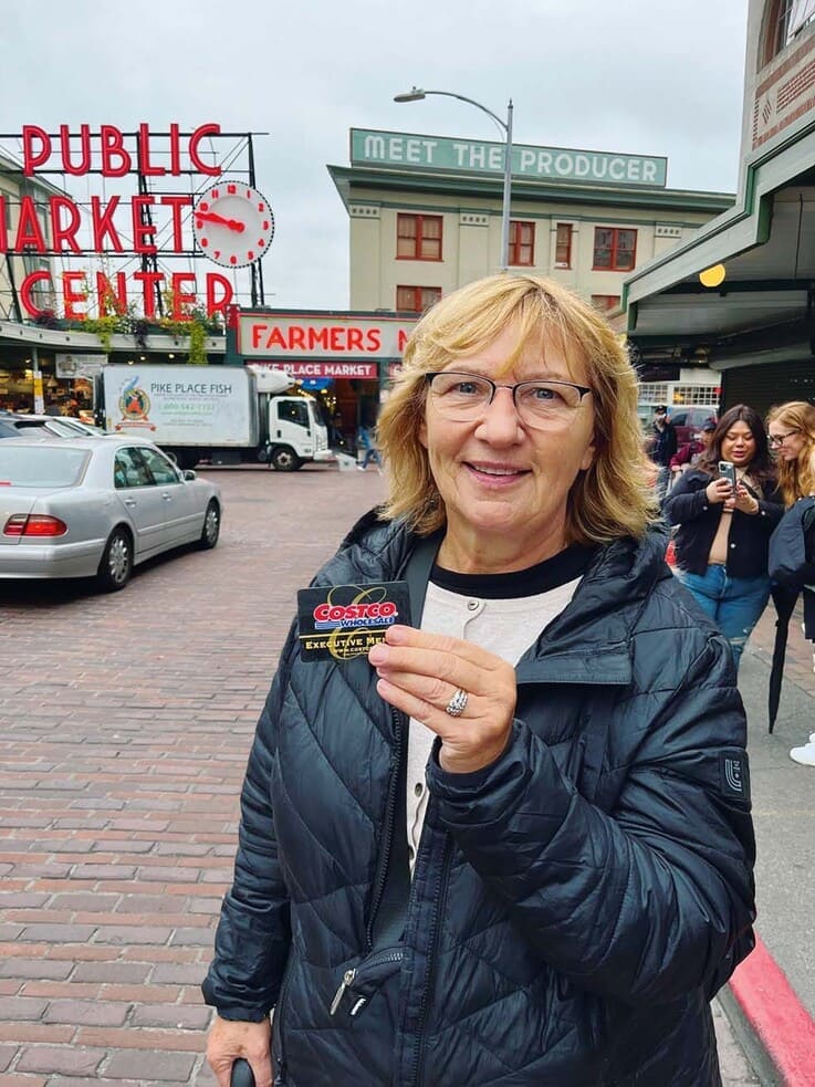 Photo of member JUDY DUMANSKI holding her membership card