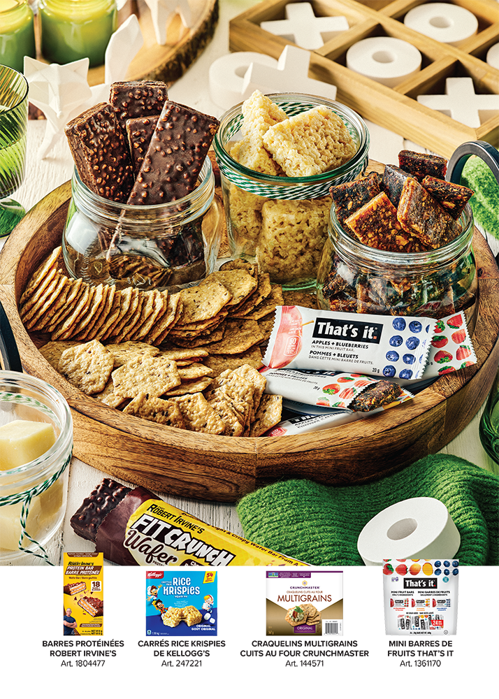 Publicité pour variété de collations saines, incluant barres et biscuits, disposées artistiquement autour d’un plateau