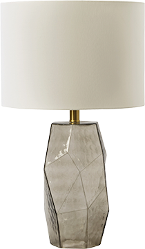 Table lamp with a geometric-patterned marble base and a white lampshade