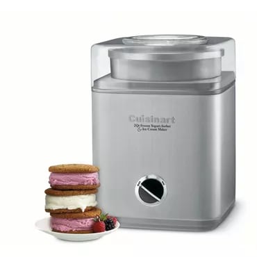 A Cuisinart ice cream maker with a stack of ice cream sandwiches next to it