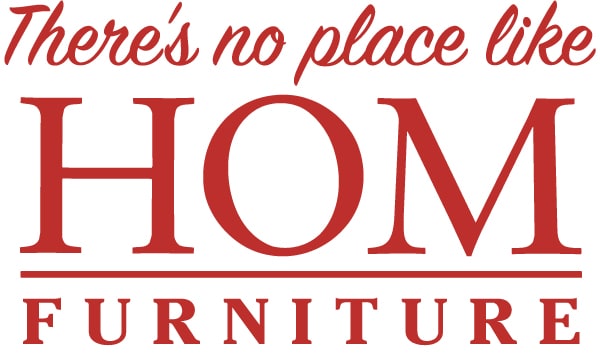 Logo of HOM Furniture with text "There's no place like HOM