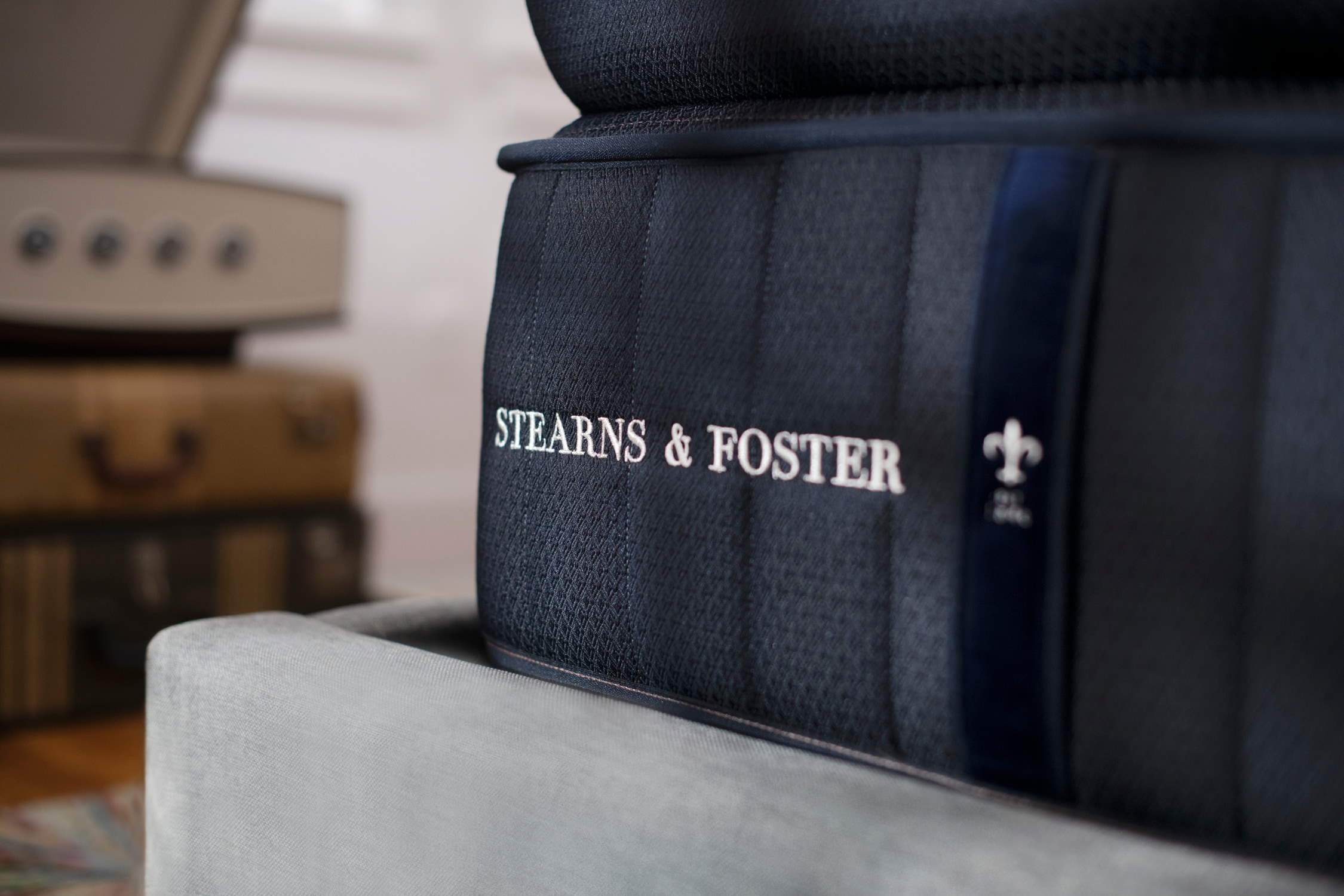 Close-up of a Stearns & Foster mattress edge with logo embroidery