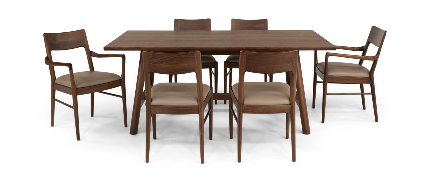 Rectangular wooden dining table with six matching chairs on a white background