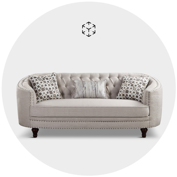 Elegant beige tufted sofa with decorative pillows