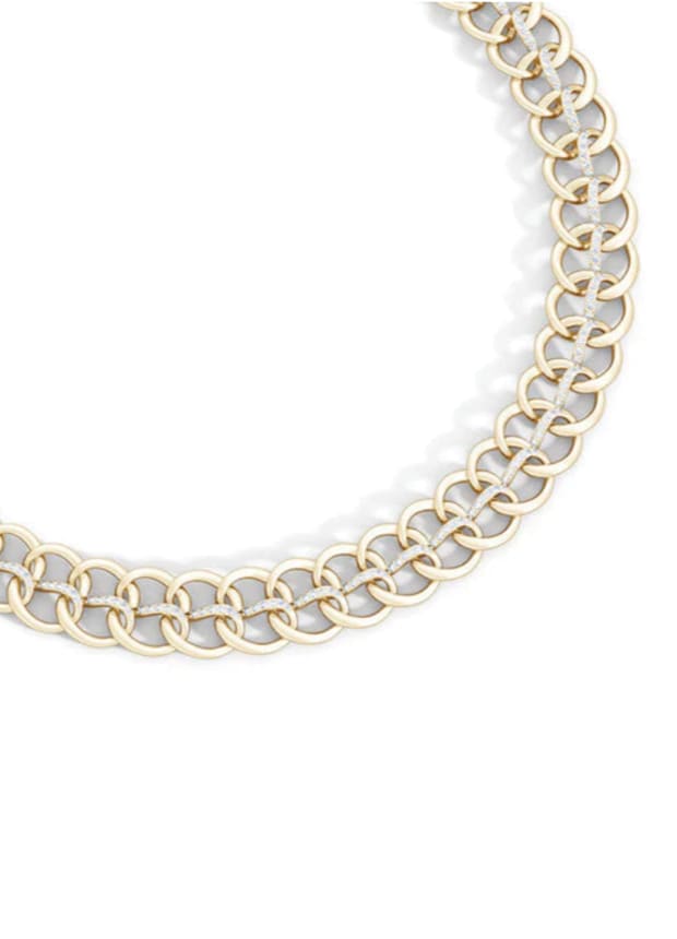 Gold chain necklace on a white background