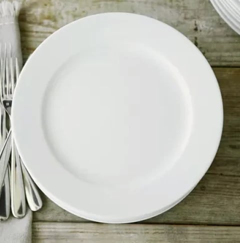 white bistro dinner plate on wood table